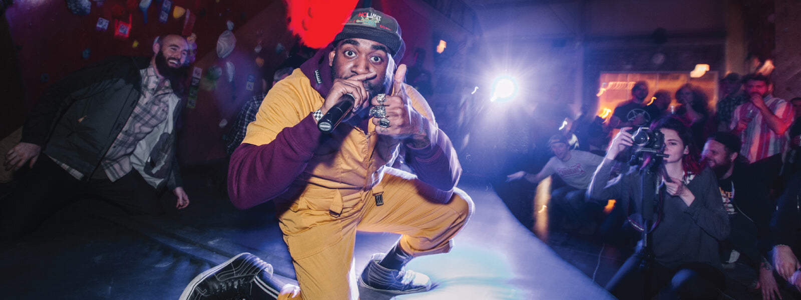 Man performing at indoor rock climbing event