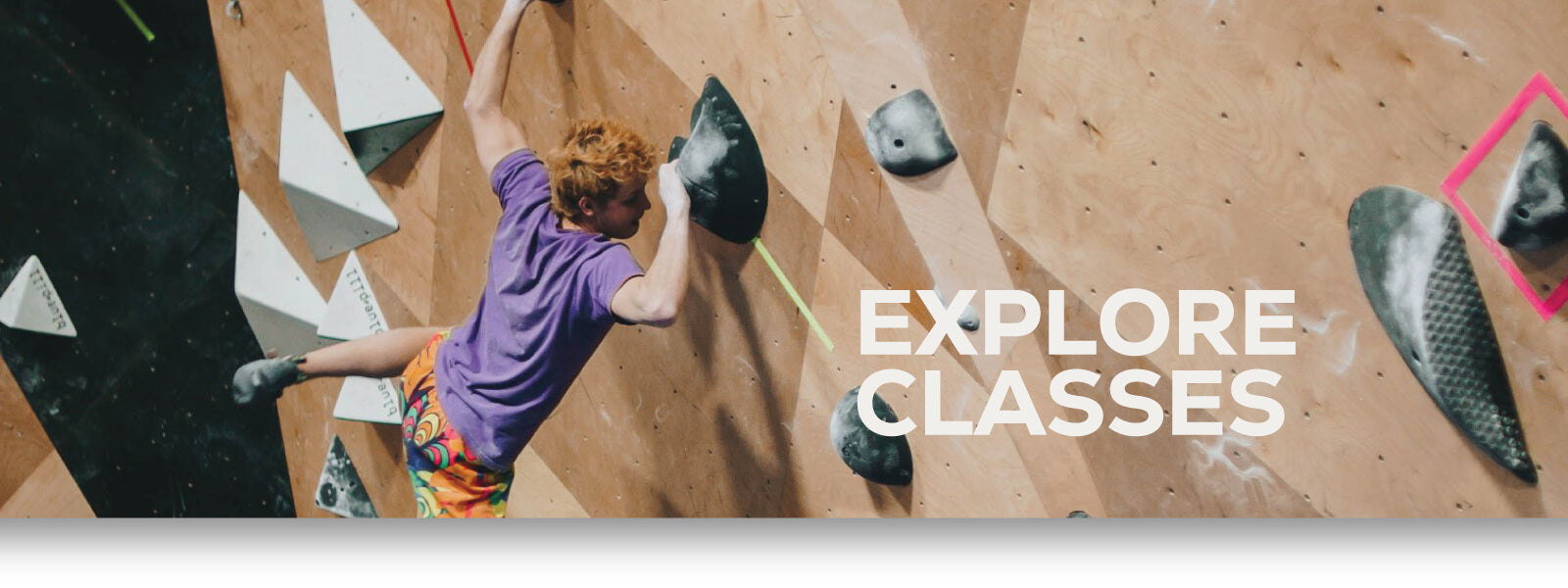 Explore classes - Man indoor rock climbing